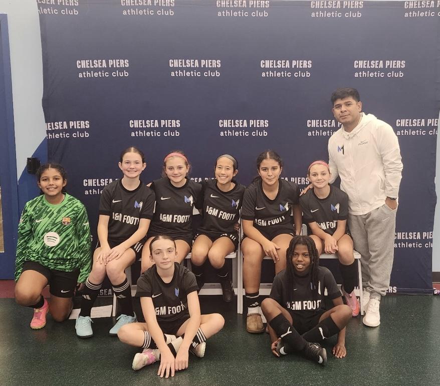 A&M Footy team with coach and players in AGM Footy jerseys