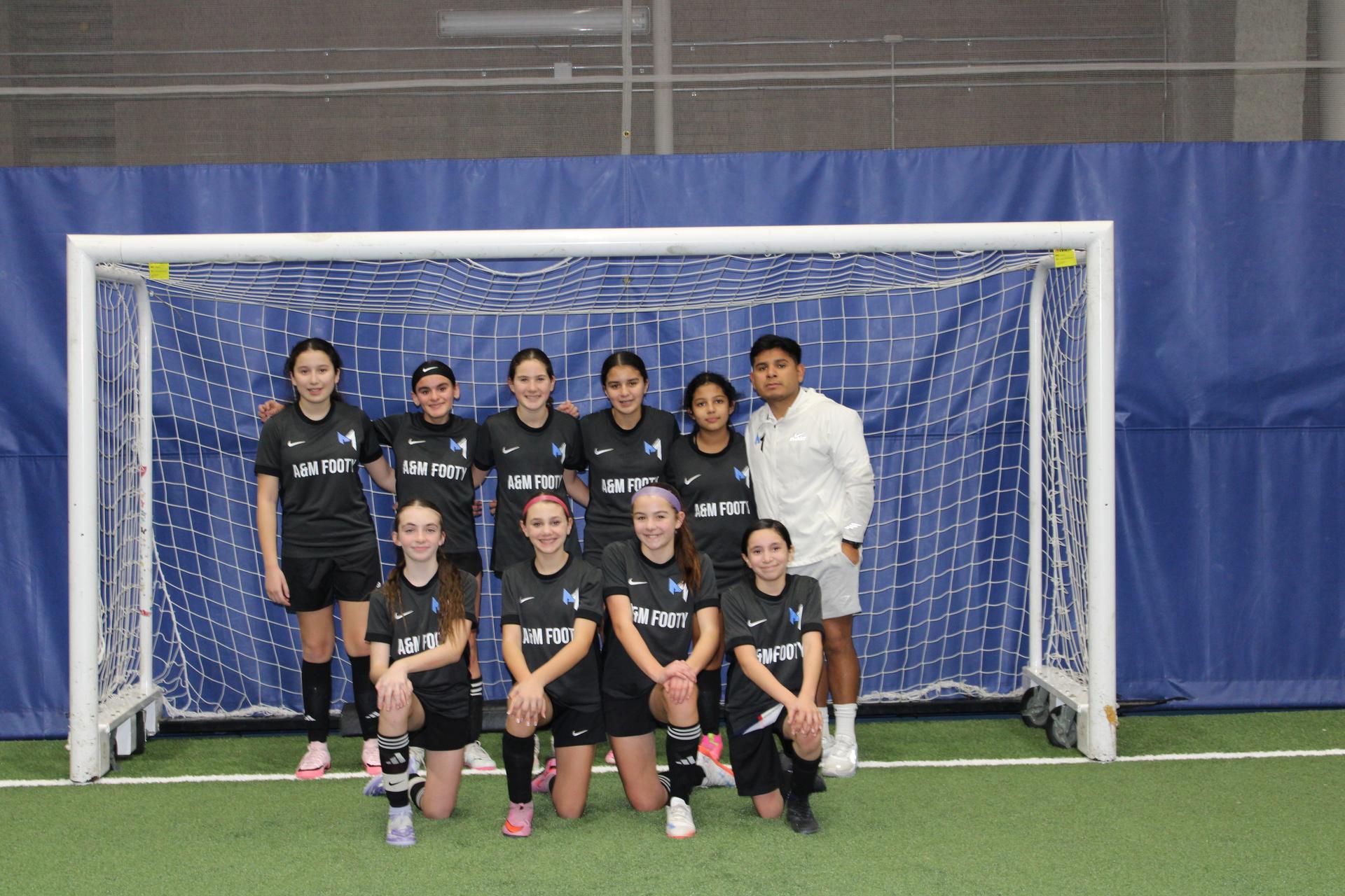 A&M Footy Girls Team with Coach